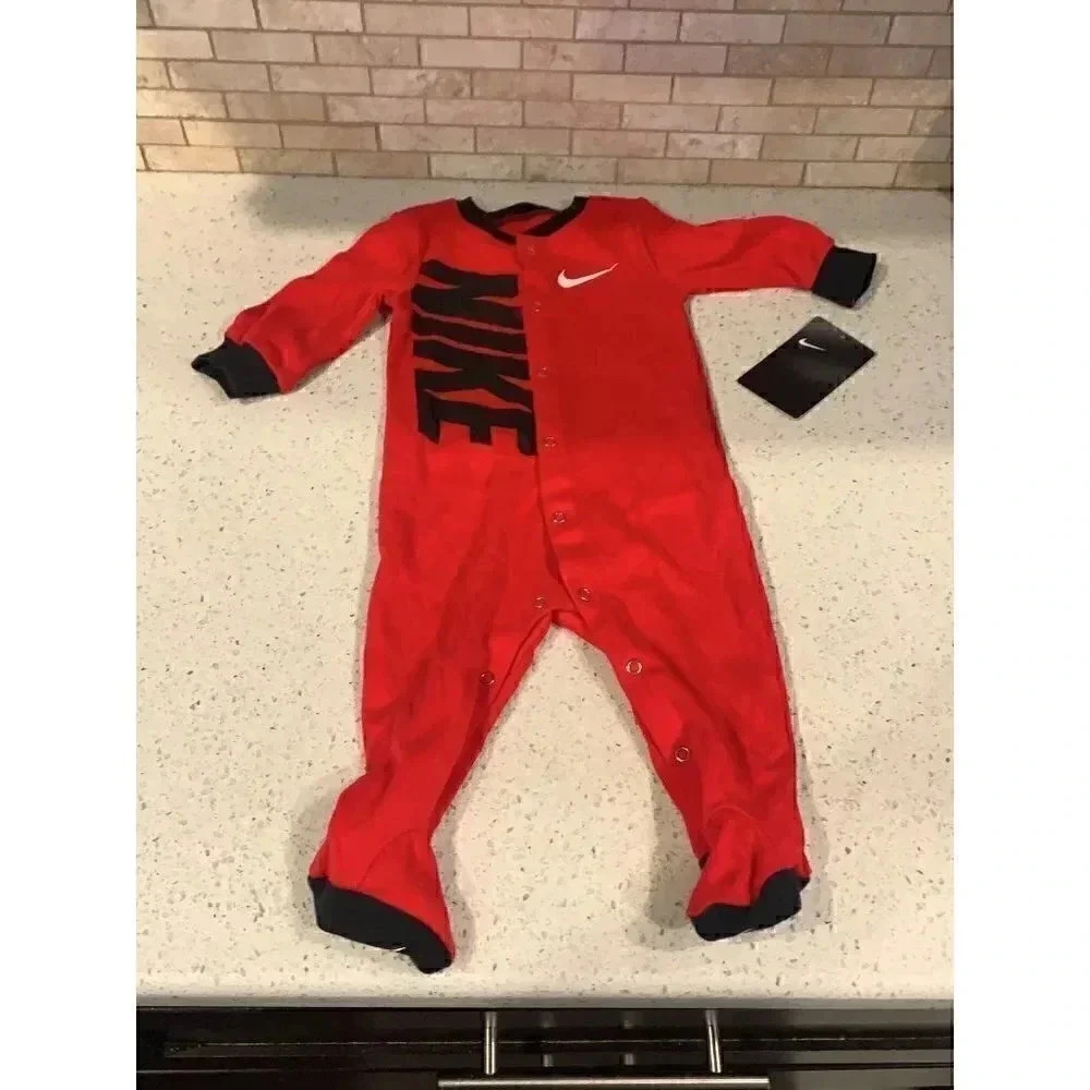 Baby Nike swoosh sleep and play footed B1